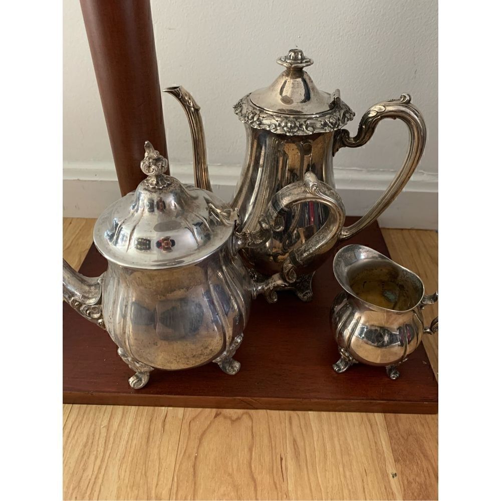 Silver coffee and tea pots with creamer dish